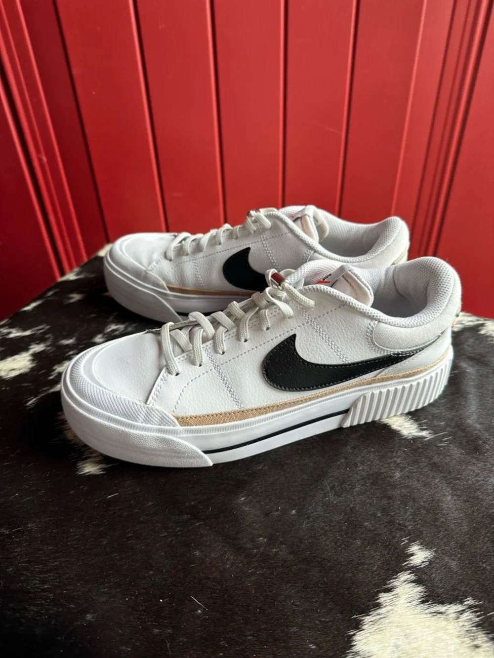 Nike White Low-Top Sneakers with Black Swoosh and Gold Trim - Picture 7 of 7